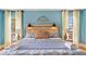 Cozy bedroom with a wooden headboard, 'Sweet Dreams' sign, decorative lighting, and comfortable bedding at 4916 Palmetto Point Dr, Palmetto, FL 34221