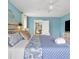 Bright bedroom features an open doorway, ceiling fan, and plenty of natural light at 4916 Palmetto Point Dr, Palmetto, FL 34221