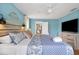 Bright bedroom features an open doorway, ceiling fan, and plenty of natural light at 4916 Palmetto Point Dr, Palmetto, FL 34221