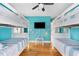Charming bedroom features bunkbeds, tv, and a table and chairs at 4916 Palmetto Point Dr, Palmetto, FL 34221