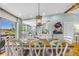 Dining room next to the kitchen offers a view with a fully set table with chairs and table setting at 4916 Palmetto Point Dr, Palmetto, FL 34221
