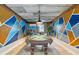 Unique game room features a pool table, geometric wall art, corrugated metal ceiling, and modern lighting at 4916 Palmetto Point Dr, Palmetto, FL 34221