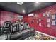 Enjoy movies in this home theater with plush seating, decorative accents, and ambient lighting for a cinematic feel at 4916 Palmetto Point Dr, Palmetto, FL 34221