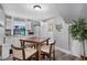 A cozy kitchen with a dining table and chairs is well-lit by a window and overhead light at 4916 Palmetto Point Dr, Palmetto, FL 34221