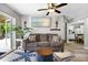 Comfortable living space with access to the backyard, hardwood floors, and easy access to the kitchen at 4916 Palmetto Point Dr, Palmetto, FL 34221