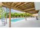 Private backyard pool with lounge seating, lush tropical landscaping, and a unique spiral staircase at 4916 Palmetto Point Dr, Palmetto, FL 34221