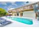 Backyard with a swimming pool, sundeck, multi-level decks, spiral staircase, and outdoor seating at 4916 Palmetto Point Dr, Palmetto, FL 34221
