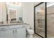 Bathroom boasts granite countertops, modern fixtures, and a glass-enclosed shower at 4973 Antiquity Way, Sarasota, FL 34240