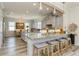 Open concept kitchen with granite counters, a breakfast bar, and modern gray cabinets and finishes at 4973 Antiquity Way, Sarasota, FL 34240