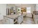 Well-equipped kitchen featuring an island, modern cabinets, and stainless steel appliances, perfect for cooking at 4973 Antiquity Way, Sarasota, FL 34240