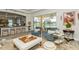 Bright living room featuring stylish furniture, neutral color palette, and view to outdoor patio at 4973 Antiquity Way, Sarasota, FL 34240