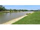 Scenic view of the pond, enhancing the tranquil setting of the property with abundant wildlife at 4973 Antiquity Way, Sarasota, FL 34240