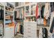 Well-organized walk-in closet with custom shelving and drawers, providing ample storage space at 4973 Antiquity Way, Sarasota, FL 34240
