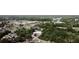 Aerial view of home and surrounding neighborhood with mature trees and landscaping at 5004 Grainary Ave, Tampa, FL 33624