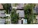 Aerial view of home and property featuring mature trees and landscaping at 5004 Grainary Ave, Tampa, FL 33624
