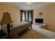 Comfortable bedroom featuring neutral walls, plush carpet and a television at 5004 Grainary Ave, Tampa, FL 33624