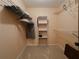 Well-organized walk-in closet with shelves, rods, and ample space for clothing and accessories storage at 5004 Grainary Ave, Tampa, FL 33624