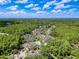 Breathtaking aerial view featuring the community's layout, complete with lush trees, pools, and well-maintained buildings at 5125 Palm Springs Blvd # 3108, Tampa, FL 33647