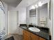 Bathroom features a dark granite countertop and plenty of natural light at 5125 Palm Springs Blvd # 3108, Tampa, FL 33647