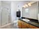 Well-maintained bathroom featuring a shower, toilet, vanity with storage, and a large mirror at 5125 Palm Springs Blvd # 3108, Tampa, FL 33647