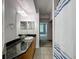 Bathroom features a vanity with granite countertop and tile flooring at 5125 Palm Springs Blvd # 3108, Tampa, FL 33647
