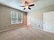 Serene bedroom featuring carpeted floors, a ceiling fan, and a window with natural light at 5125 Palm Springs Blvd # 3108, Tampa, FL 33647