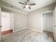 Inviting bedroom featuring wood-look floors, a ceiling fan, and a closet for convenient storage at 5125 Palm Springs Blvd # 3108, Tampa, FL 33647