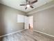 Comfortable bedroom with wood-look floors, a ceiling fan, and ample space for relaxation and personalization at 5125 Palm Springs Blvd # 3108, Tampa, FL 33647