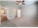 Spacious carpeted bedroom features a ceiling fan and walk-in closet at 5125 Palm Springs Blvd # 3108, Tampa, FL 33647