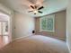 Bedroom featuring a ceiling fan and access to a screened patio at 5125 Palm Springs Blvd # 3108, Tampa, FL 33647