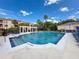 Large community pool with comfortable seating, sun umbrellas, and a pergola at 5125 Palm Springs Blvd # 3108, Tampa, FL 33647