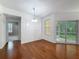 Cozy dining area features hardwood floors, a pendant light fixture, and sliding glass doors at 5125 Palm Springs Blvd # 3108, Tampa, FL 33647