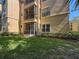 Exterior view of the building's patio and lawn at 5125 Palm Springs Blvd # 3108, Tampa, FL 33647