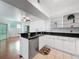 An open kitchen area with stainless steel appliances, granite countertops, and an eat-in area at 5125 Palm Springs Blvd # 3108, Tampa, FL 33647