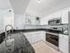 Bright kitchen with stainless steel appliances, granite countertops and tiled floors at 5125 Palm Springs Blvd # 3108, Tampa, FL 33647