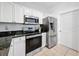 A bright kitchen featuring stainless steel appliances and granite countertops at 5125 Palm Springs Blvd # 3108, Tampa, FL 33647