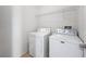 A simple laundry room with a standard washer and dryer at 5125 Palm Springs Blvd # 3108, Tampa, FL 33647