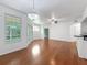 Charming living area with hardwood floors, chandelier, and sliding door to the patio at 5125 Palm Springs Blvd # 3108, Tampa, FL 33647