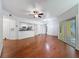 Spacious living area with hardwood floors, modern lighting, and open access to the kitchen at 5125 Palm Springs Blvd # 3108, Tampa, FL 33647