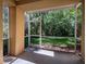 Spacious screened-in patio overlooking the lush green landscape at 5125 Palm Springs Blvd # 3108, Tampa, FL 33647