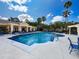 Sparkling community pool and spa provides relaxation and recreation with palm trees and sunshine at 5125 Palm Springs Blvd # 3108, Tampa, FL 33647