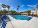 Resort-style pool with lounge chairs and pergola offers a relaxing oasis with clear blue skies above at 5125 Palm Springs Blvd # 3108, Tampa, FL 33647