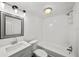 Bright bathroom features white tile bathtub, vanity, and modern fixtures at 549 39Th Ne Ave, St Petersburg, FL 33703