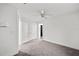 Bright bedroom features carpet, ceiling fan, and white trim and doors at 549 39Th Ne Ave, St Petersburg, FL 33703