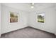 Bedroom with two windows allows for plenty of natural light and gray carpet at 549 39Th Ne Ave, St Petersburg, FL 33703