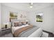Bedroom features neutral decor, stylish bedding and two windows at 549 39Th Ne Ave, St Petersburg, FL 33703