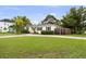 Charming single-story home with a well-manicured lawn, mature trees, and a classic white exterior at 549 39Th Ne Ave, St Petersburg, FL 33703
