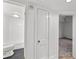 Hallway featuring access to bathroom and bedroom with neutral decor at 549 39Th Ne Ave, St Petersburg, FL 33703