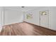Bright living room featuring wood flooring, fresh white paint and a large window for great natural light at 549 39Th Ne Ave, St Petersburg, FL 33703