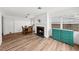 The living room boasts wood floors and a fireplace, next to a dining area at 549 39Th Ne Ave, St Petersburg, FL 33703